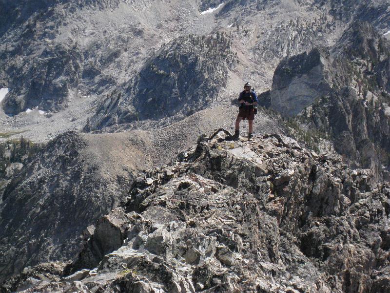 IMG_3994.jpg - A close up of Rickey on the little sub peak.  The floor of the valley is a looong way down!